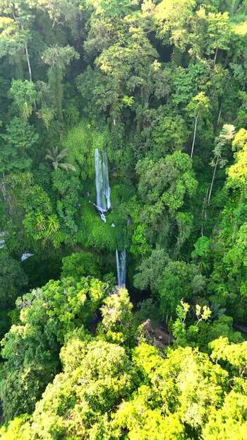 Aerial view of Sendang Gile Waterfall in the jungle Indonesia. Aerial view of Sendang Gile Waterfall in the jungle Indonesia.