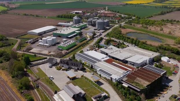 Aerial view of an industrial complex and silos in Czechia. Aerial view of an industrial complex and silos in Czechia.