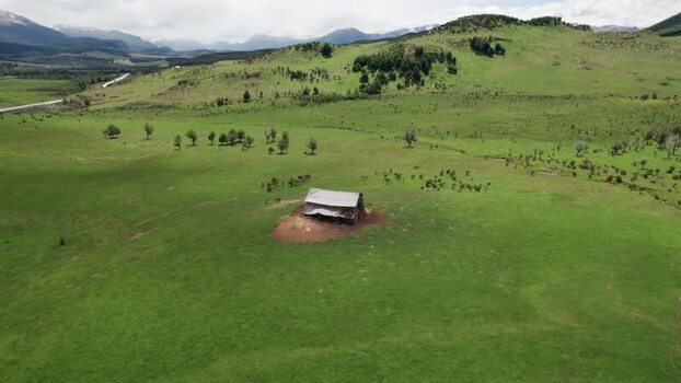 Aerial view of a lonely house in a green field in Chile. Aerial view of a lonely house in a green field in Chile.