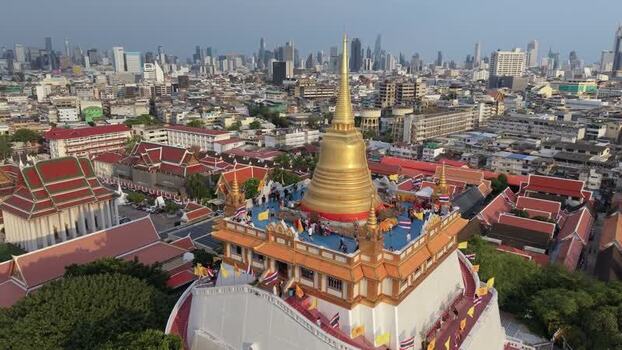Aerial view of Wat Saket and the city skyline in Bangkok Thailand.