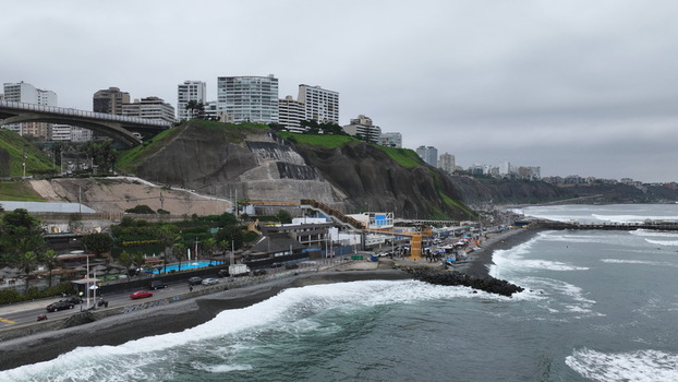 Aerial view of the coastal district of Barranco with its iconic cliffs modern buildings and the Pacific Ocean shoreline in Barranco Lima Province Peru. Aerial view of the coastal district of Barranco with its iconic cliffs modern buildings and the Pacific Ocean shoreline in Barranco Lima Province Peru.