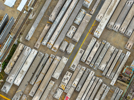 Aerial view of prestressed concrete elements stored in an industrial yard in Poland.