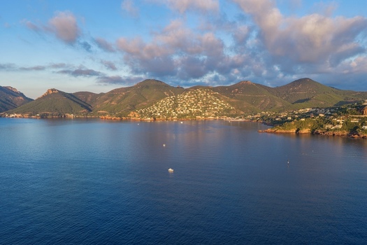 Aerial view of Le Trayas with its coastal hills Mediterranean waters and residential buildings in Saint Raphael Provence Alpes Cote d Azur France. Aerial view of Le Trayas with its coastal hills Mediterranean waters and residential buildings in Saint Raphael Provence Alpes Cote d Azur France.