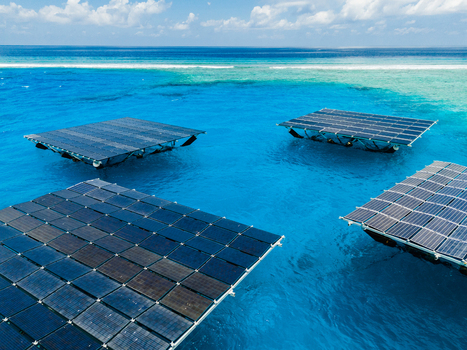 Aerial view of SolarSea floating solar power plant by Swimsol on turquoise waters near a coral reef in Dharavandhoo Baa Atoll Maldives. Aerial view of SolarSea floating solar power plant by Swimsol on turquoise waters near a coral reef in Dharavandhoo Baa Atoll Maldives.