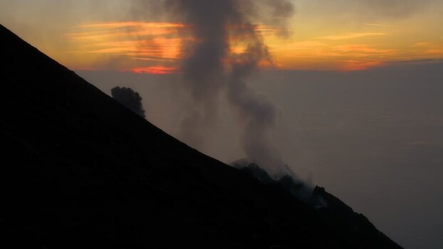 View of Stromboli volcano at sunset Italy.