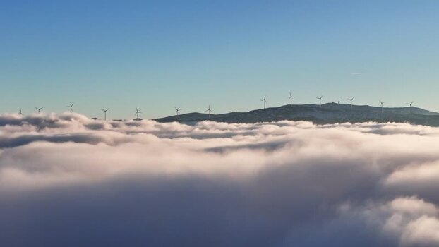 Aerial view of Windpark Freilanderalm 2 above clouds Austria. Aerial view of Windpark Freilanderalm 2 above clouds Austria.