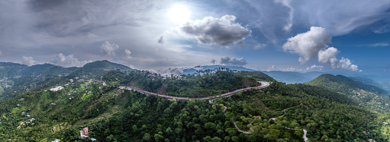 Aerial view of Islamabad Murree Expressway winding through the lush green hills and dense forests of Lower Topa Punjab Pakistan. Aerial view of Islamabad Murree Expressway winding through the lush green hills and dense forests of Lower Topa Punjab Pakistan.