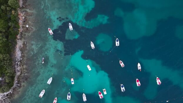 Aerial view of boats in the turquoise waters of Albania.