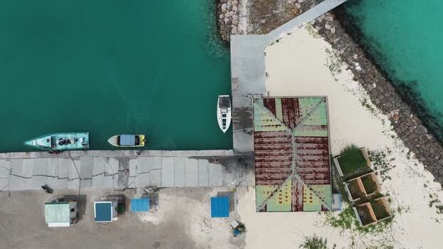 Aerial view of boats docked at a pier in Hanimaadhoo Maldives. Aerial view of boats docked at a pier in Hanimaadhoo Maldives.