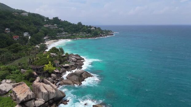 Aerial view of Mahe coastline with granite boulders Seychelles.