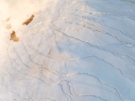 Aerial view of the geothermal landscape of Reykjanes with mineral rich deposits steaming vents and volcanic terrain in Grindavikurbaer Iceland. Aerial view of the geothermal landscape of Reykjanes with mineral rich deposits steaming vents and volcanic terrain in Grindavikurbaer Iceland.