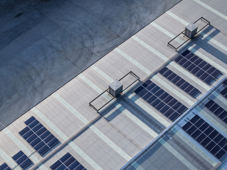 Aerial view of solar panels installed on a large industrial factory roof in Kilsyth South Melbourne VIC Australia. Aerial view of solar panels installed on a large industrial factory roof in Kilsyth South Melbourne VIC Australia.