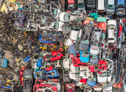 Aerial view of end of life vehicle recycling facility with stacks of crushed and dismantled cars in Gdansk Pomeranian Voivodeshi Poland.