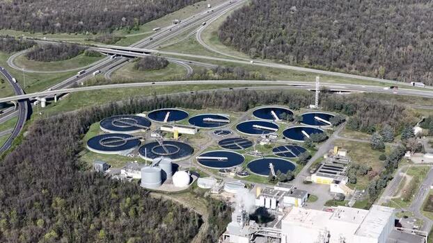 Aerial view of highway and water treatment plant France.