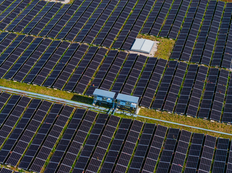 Aerial view of the solar farm at Logistikzentrum Allhaming with rows of photovoltaic panels arranged in a large field in Allhaming Oberosterreich Austria. Aerial view of the solar farm at Logistikzentrum Allhaming with rows of photovoltaic panels arranged in a large field in Allhaming Oberosterreich Austria.