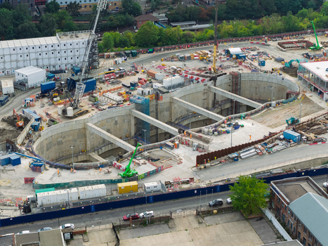 Aerial view of a large data center construction site featuring deep concrete excavations heavy machinery and cranes United Kingdom. Aerial view of a large data center construction site featuring deep concrete excavations heavy machinery and cranes United Kingdom.