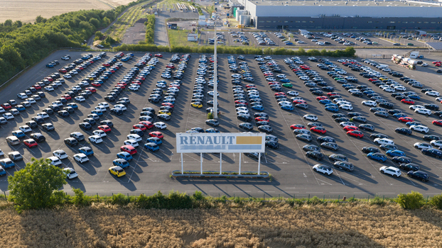 Lambres lez Douai France 07 July 2026 Aerial view of the Renault vehicle storage facility with rows of parked cars a large Renault sign and surrounding industrial infrastructure.