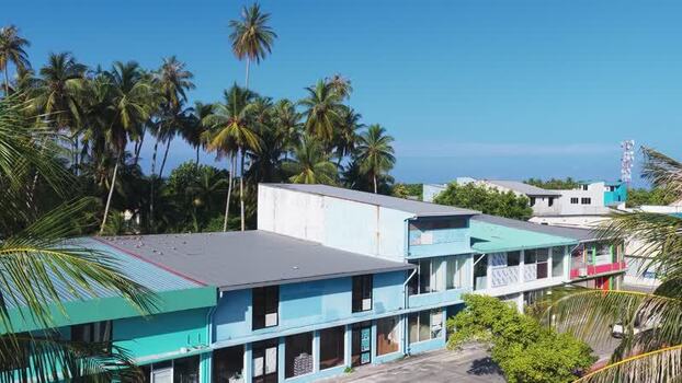 Aerial view of tropical buildings and palm trees Maldives. Aerial view of tropical buildings and palm trees Maldives.