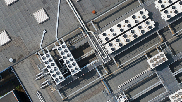 Aerial view of the industrial rooftop of NorthC Datacenters Nieuwegein featuring cooling fans and HVAC systems in Nieuwegein Utrecht Netherlands. Aerial view of the industrial rooftop of NorthC Datacenters Nieuwegein featuring cooling fans and HVAC systems in Nieuwegein Utrecht Netherlands.