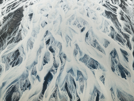 Aerial view of glacial rivers carve intricate patterns across the stark landscape a symphony of icy blues and earthy browns creating a mesmerizing abstract masterpiece Iceland Iceland. Aerial view of glacial rivers carve intricate patterns across the stark landscape a symphony of icy blues and earthy browns creating a mesmerizing abstract masterpiece Iceland Iceland.