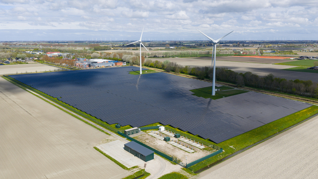 Aerial view of battery storage and mobile container charging at De Dijken Solar Park near Warmenhuizen supporting grid balance renewable energy and flexible power use. Aerial view of battery storage and mobile container charging at De Dijken Solar Park near Warmenhuizen supporting grid balance renewable energy and flexible power use.