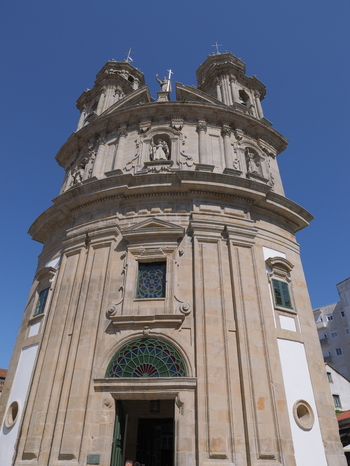 View of the Santuario de la Virgen Peregrina with its distinctive curved facade ornate stone carvings and twin bell towers in Pontevedra Pontevedra Spain.