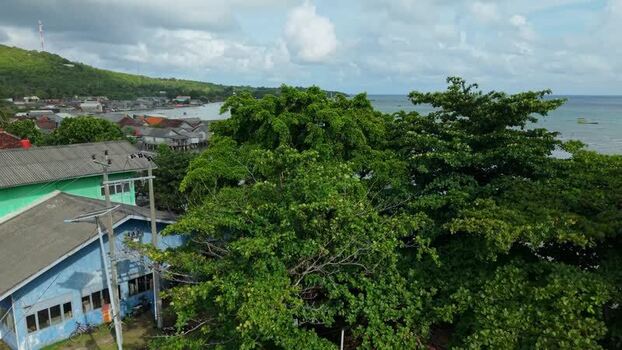 Aerial view of coastal village and boats Indonesia. Aerial view of coastal village and boats Indonesia.