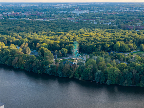 Aerial view of the Ferris wheel at Spreepark surrounded by dense forest and the Spree river Berlin Berlin Germany. Aerial view of the Ferris wheel at Spreepark surrounded by dense forest and the Spree river Berlin Berlin Germany.