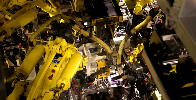 View of industrial robotic arms operating in a manufacturing facility in Jilin Jilin China. View of industrial robotic arms operating in a manufacturing facility in Jilin Jilin China.