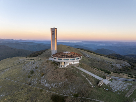 Aerial view of the Buzludzha Monument a striking brutalist structure perched on a mountain peak in Stara Zagora Bulgaria. Aerial view of the Buzludzha Monument a striking brutalist structure perched on a mountain peak in Stara Zagora Bulgaria.