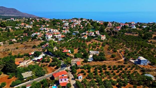 Aerial view of Crete village with red tiled roofs Greece.