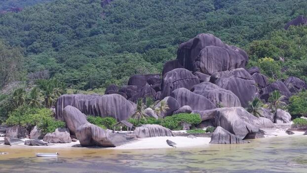 Aerial view of Anse Reunion beach with granite boulders Seychelles.