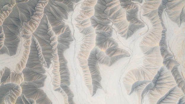 Aerial view of the intricate erosion patterns and ridges of the badlands in the desert landscape Hanksville Utah United States.