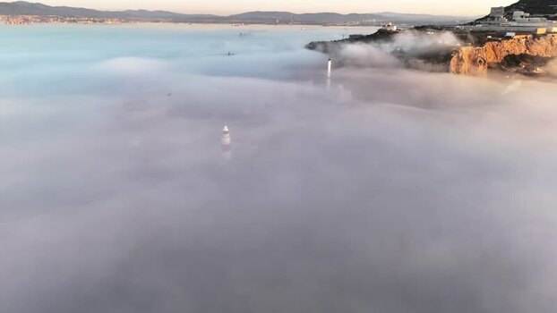 Aerial view of Europa Point lighthouse in fog Gibraltar.