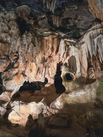 View of Cango Caves with intricate stalactites and stalagmites illuminated by artificial light within the limestone cavern Oudtshoorn Western Cape South Africa. View of Cango Caves with intricate stalactites and stalagmites illuminated by artificial light within the limestone cavern Oudtshoorn Western Cape South Africa.