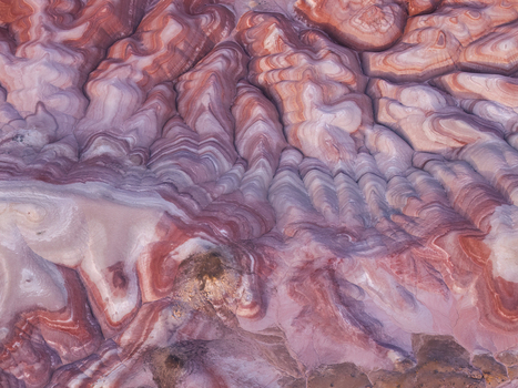 Aerial view of the colorful striped clay mounds of the Bentonite Hills in the desert landscape of Hanksville Utah United States.