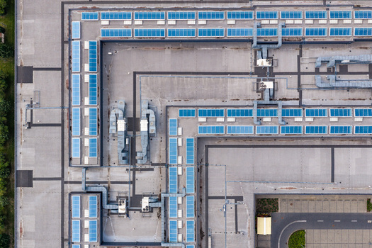 Aerial view of Factory Annopol featuring industrial rooftop infrastructure with solar panels and ventilation systems Warsaw Wojewodztwo mazowieckie Poland. Aerial view of Factory Annopol featuring industrial rooftop infrastructure with solar panels and ventilation systems Warsaw Wojewodztwo mazowieckie Poland.