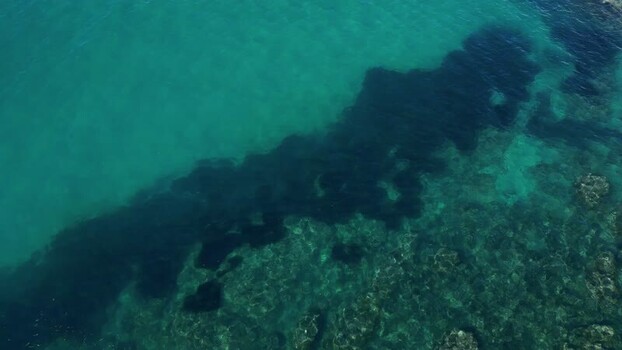 Aerial view of turquoise sea waters near the coast Spain.