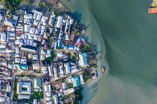 Port Harcourt Rivers Nigeria 03 July 2026 Aerial view of the dense urban waterfront featuring a mix of residential rooftops narrow streets and the calm riverbank. Port Harcourt Rivers Nigeria 03 July 2026 Aerial view of the dense urban waterfront featuring a mix of residential rooftops narrow streets and the calm riverbank.