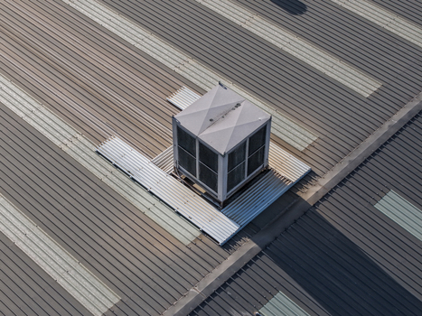 Aerial view of a ventilation unit on a corrugated metal factory roof in Kilsyth South Melbourne VIC Australia. Aerial view of a ventilation unit on a corrugated metal factory roof in Kilsyth South Melbourne VIC Australia.