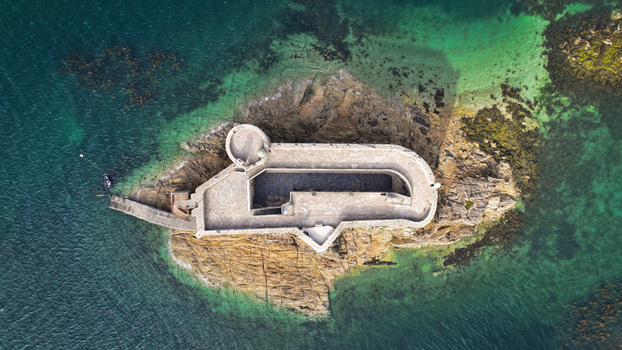 Aerial view of Château du Taureau standing steadfast against the turquoise and deep blue sea Plouezoc h Bretagne France. Aerial view of Château du Taureau standing steadfast against the turquoise and deep blue sea Plouezoc h Bretagne France.