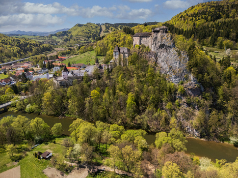Aerial view of Orava Castle perched on a steep limestone cliff overlooking the Orava river and surrounding green hills Dolny Kubin Zilinsky kraj Slovakia. Aerial view of Orava Castle perched on a steep limestone cliff overlooking the Orava river and surrounding green hills Dolny Kubin Zilinsky kraj Slovakia.