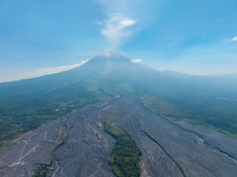 Aerial view of Mount Semeru showing the volcanic landscape and lava flow paths following a catastrophic eruption in Pronojiwo East Java Indonesia.