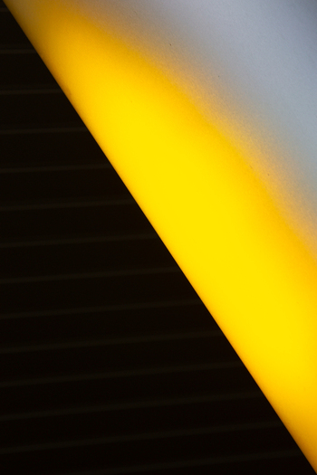 View of striking geometric contrast with a bright yellow beam slicing through a dark textured surface creating a bold visual statement Almere Flevoland Netherlands. View of striking geometric contrast with a bright yellow beam slicing through a dark textured surface creating a bold visual statement Almere Flevoland Netherlands.