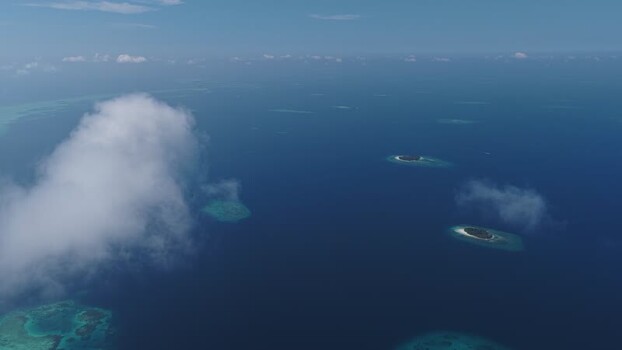 Aerial view of tropical islands and coral reefs in the Maldives. Aerial view of tropical islands and coral reefs in the Maldives.