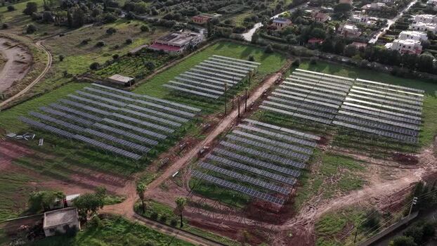 Aerial view of solar panels in a field in Terrasini Italy.