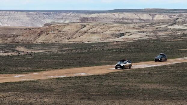 Aerial view of off road vehicles driving near Bozjyra Kazakhstan.