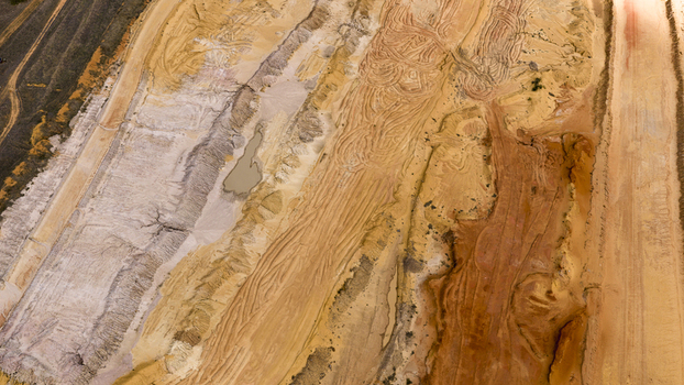 Aerial view of industrial salt mine patterns with textured sand salt deposits and earth tones near Useless Loop in Kalbarri Western Australia Australia. Aerial view of industrial salt mine patterns with textured sand salt deposits and earth tones near Useless Loop in Kalbarri Western Australia Australia.