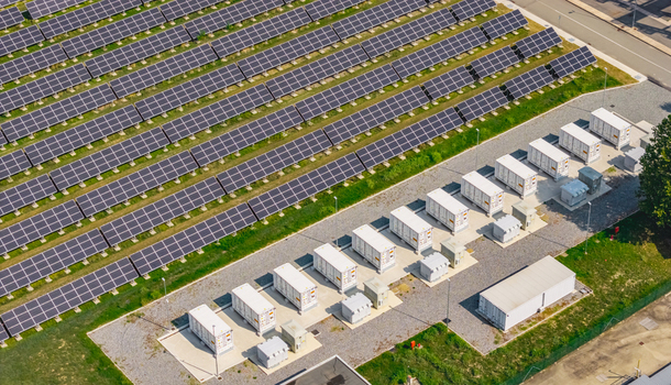 Aerial view of a large photovoltaic solar farm combined with battery energy storage systems showing utility scale renewable power infrastructure in Italy. Aerial view of a large photovoltaic solar farm combined with battery energy storage systems showing utility scale renewable power infrastructure in Italy.