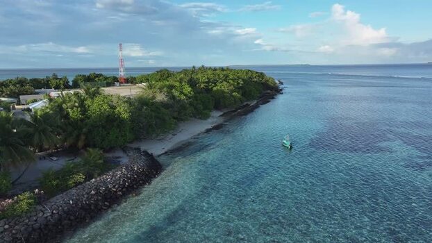 Aerial view of a tropical island coastline and clear water Maldives. Aerial view of a tropical island coastline and clear water Maldives.